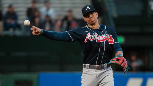 Atlanta Braves second baseman Ehire Adrianza (17) throws to first base during the first inning against the SF Giants at Oracle Park. (2022)